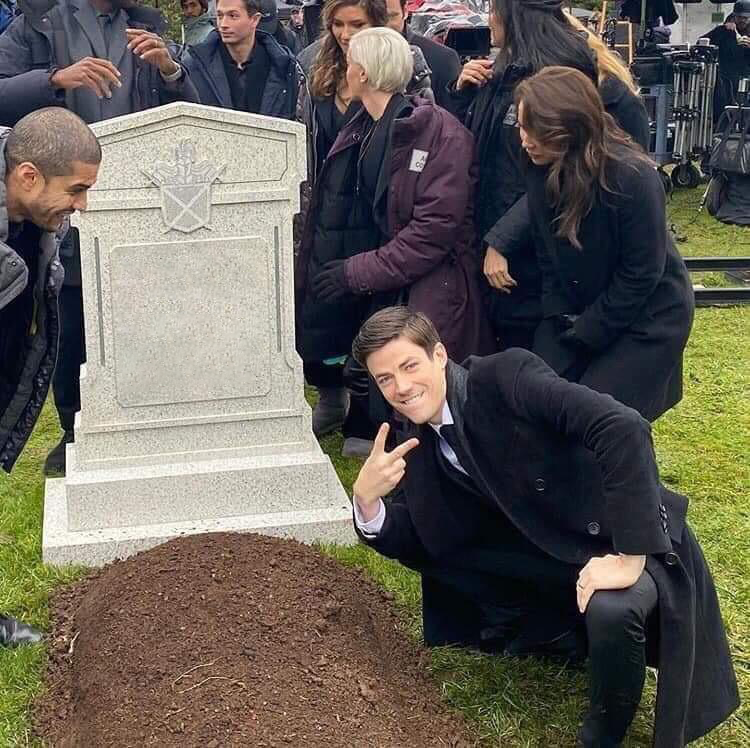 Guy posing in front of grave blank meme template